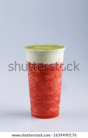 strawberry machiato ice blended in plastic to take away