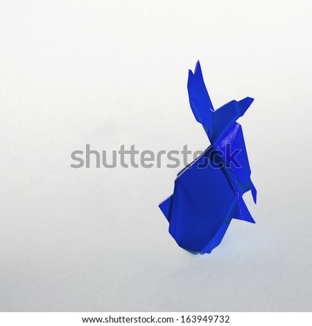 Origami Blue rabbit isolated on white