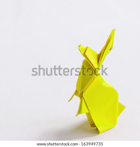 Origami Yellow rabbit isolated on white
