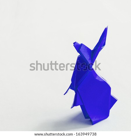 Origami Blue rabbit isolated on white