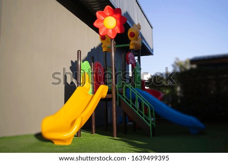 Colorful children playground on yard, stock photo