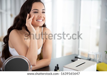 Attractive young woman looking away and smiling stock photo. Website banner