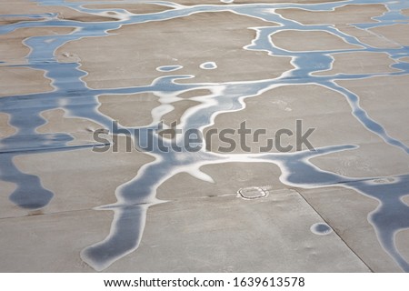 Membrane roofing. Drawing water on the roof of the membrane. Conceptual. Royalty-Free Stock Photo #1639613578
