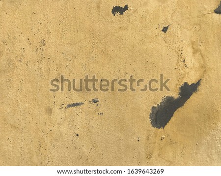 Yellow concrete wall. Unique and vintage wall. Use as wallpaper or background.