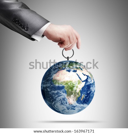 Man's hand holding Earth (CONCEPT) "Elements of this image furnished by NASA" 