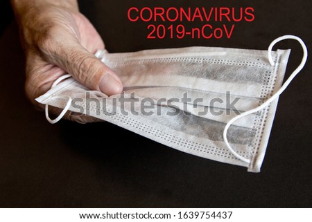 Coronavirus  2019 -nCoV . An elderly man is holding a mask. Selective focus. Coronavirus outbreak awareness.