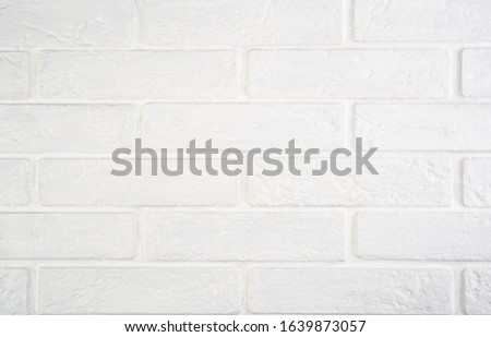 White natural brick background with texture.
