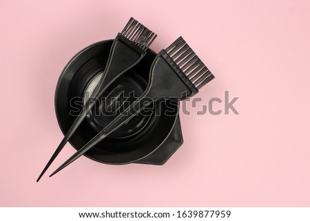 Tools for hairdresser, for painting hair on a pink background Royalty-Free Stock Photo #1639877959