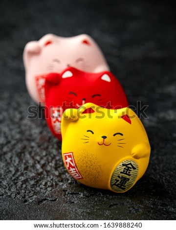 Maneki Neko Feng Shui japanese lucky cats: red for good health, yellow for wealth and pink for love and romance