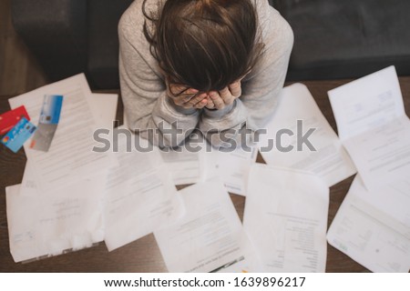 Shocked stressed young woman reading document letter from bank about loan debt financial problem, frustrated worried about bills notification, troubled with bad news or failed test results in mail Royalty-Free Stock Photo #1639896217