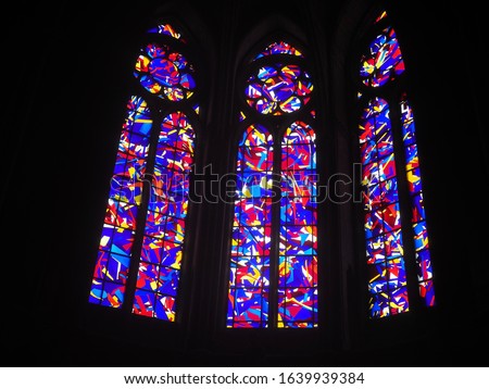 beautiful colorful stain glass windows against a black background, with all the color of a rainbow        