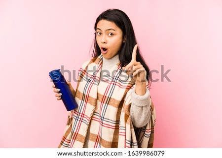 Young chinese woman doing a camping isolated on pink background smiling cheerful showing number five with fingers.