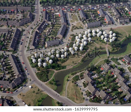 's Hertogenbosch, Holland, August 3 - 1990: Historical aerial photo of the bolwoningen, Neighborhood of Spherical Homes, in de Maaspoort at 's-Hertogenbosch, Holland  