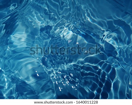 The​ metal​ texture of blue​ water​ in deep​ sea​ for​ background. Blue​ water​ texture​ for​ background​