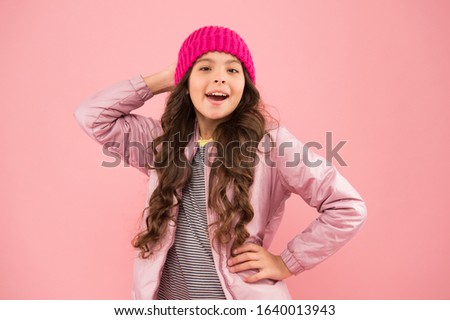 Winter activities. little girl puffer jacket and knitted hat. health care in cold weather. 