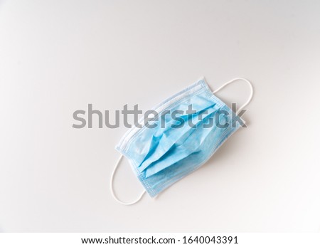 White background, a medical disposable mask