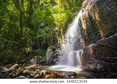 Kionsom Waterfall in Tropical Rainforest. Kota KInabalu Sabah.