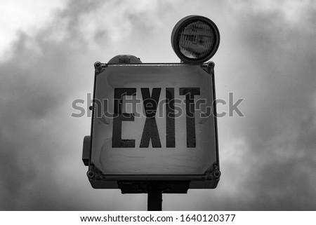 black and white exit sign