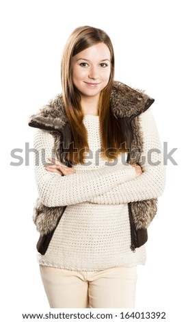 Beautiful woman in sweater is posing in studio, winter fashion