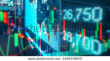 Financial stock market numbers and city light reflections 