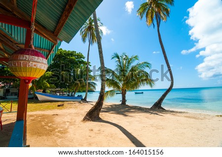 Beach, palm trees, and turquoise water in San Andres y Providencia, Colombia Royalty-Free Stock Photo #164015156