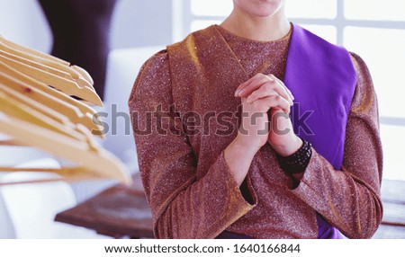 Woman sitting in bed reading a book and having breakfast