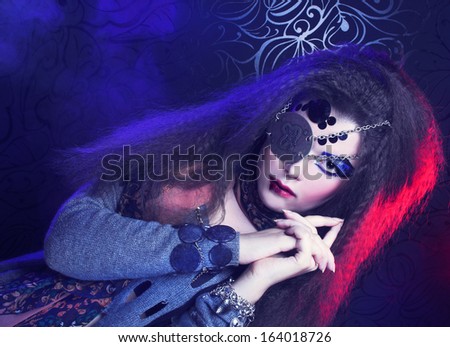 Pirate. One-eyed young woman with artistic visage.