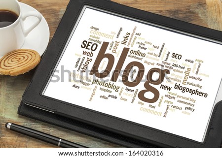 cloud of words or tags related to blogging and blog design on a  digital tablet with cup of coffee Royalty-Free Stock Photo #164020316