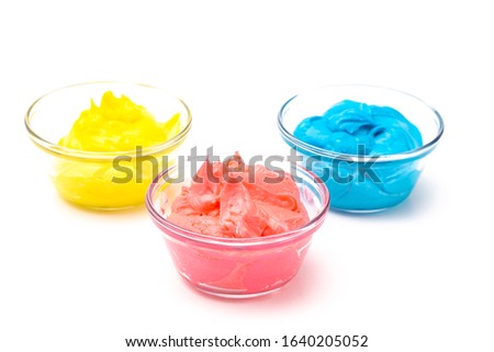Bowls of Primary Colored Icing Mixed withed with Gel Food Coloring