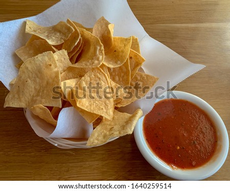 Chips and salsa, a traditional mexican appetizer.