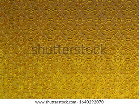 Pattern on the glass, yellow background