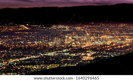 Aerial night view of the brightly illuminated downtown area of San Jose, Silicon Valley, California;