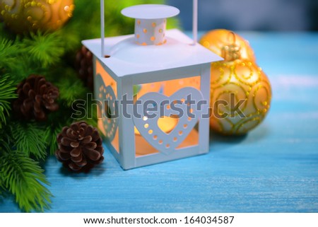Christmas lantern, fir tree and decorations  on light background