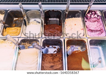 Many flavors of Italian Ice-Cream (Gelato) including Chocolate, Vanilla, Blueberry Cheesecake, Sea Salt Caramel etc. in refrigerator. 