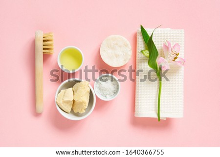 Natural skin care products, organic ingredients for healthy face care on the pink background, top view