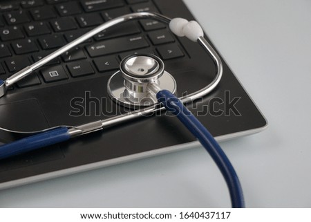 Close up stethoscope on laptop, health concept.