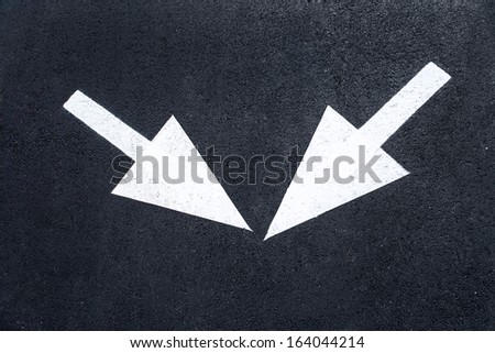 Arrow signs as road markings / photography of road markings and traffic symbol on surface road 