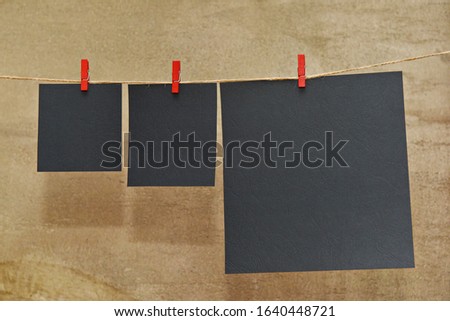 clean sheets of paper on a string with clothespins