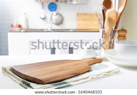 Wooden cutting boards and blank napkin placed on the table, retro kitchen background / area for you to montage the product
