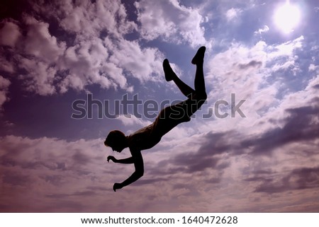 A silhouette of woman flying in the sky. Afterlife, mystery and dream concept