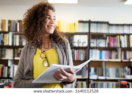Education, high school, university, learning and people concept. Smiling student girl reading book Royalty-Free Stock Photo #1640512528