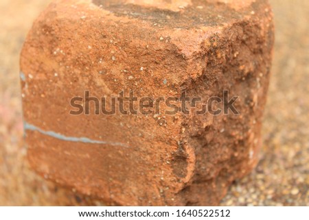 Solid clay bricks used for construction,Old red brick isolated On the rocky ground 