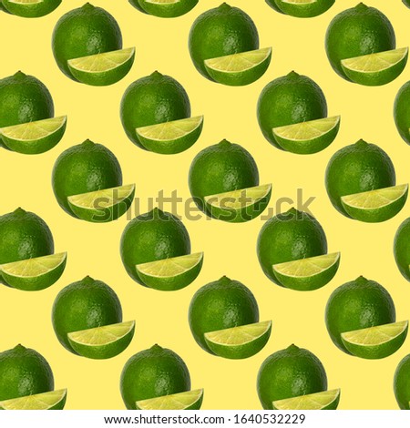 Seamless pattern with limes isolated on yellow. Food background.