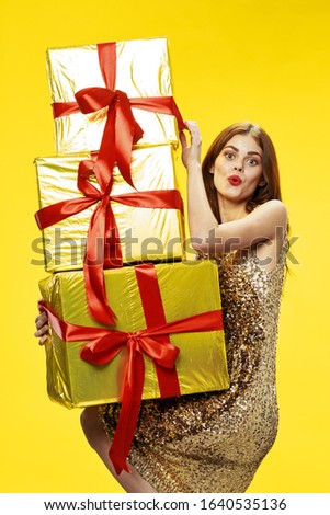 gift boxes with red bows and beautiful woman holidays