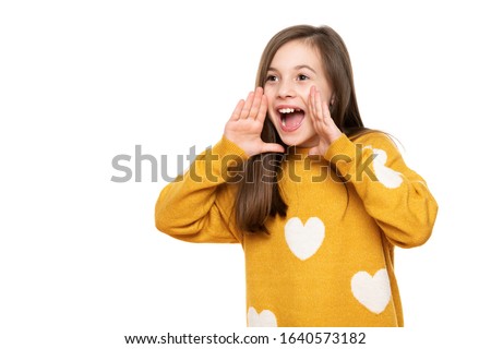 Studio portrait of an adorable young girl screaming with excitement, isolated on white backgroud. Human emotions and facial expressions concept. Royalty-Free Stock Photo #1640573182