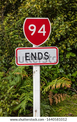 The end of the Milford Road, officially known as State Highway 94, at the harbour site of Milford Sound, Fiordland, New Zealand