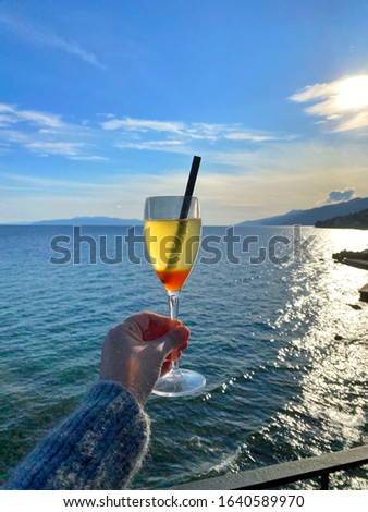 Glass of Mimosas ( Champagne and Orange juice ) with sea view