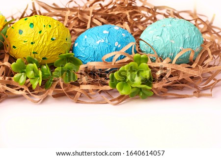 Spring Easter colorful painted eggs on the white background flat lay closeup top view beautiful picture. Congratulations card happy holiday