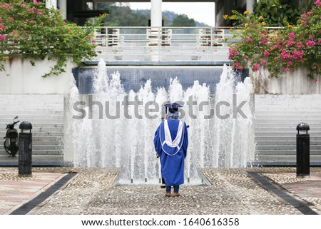 Asian muslim college graduate with university dress after convocation