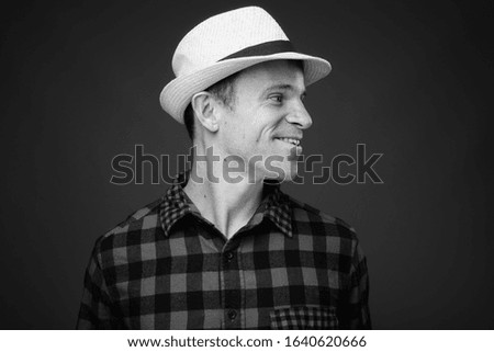 Portrait of tourist man ready vacation against gray background